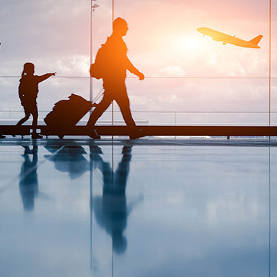 a rather and daughter at an airport